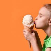 kid kissing an icecream